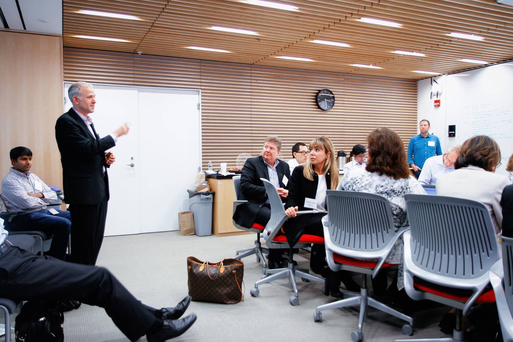 Wide view of the workshop room showing multiple participants during the drug development in the connected world symposium at the MIT Media Lab.